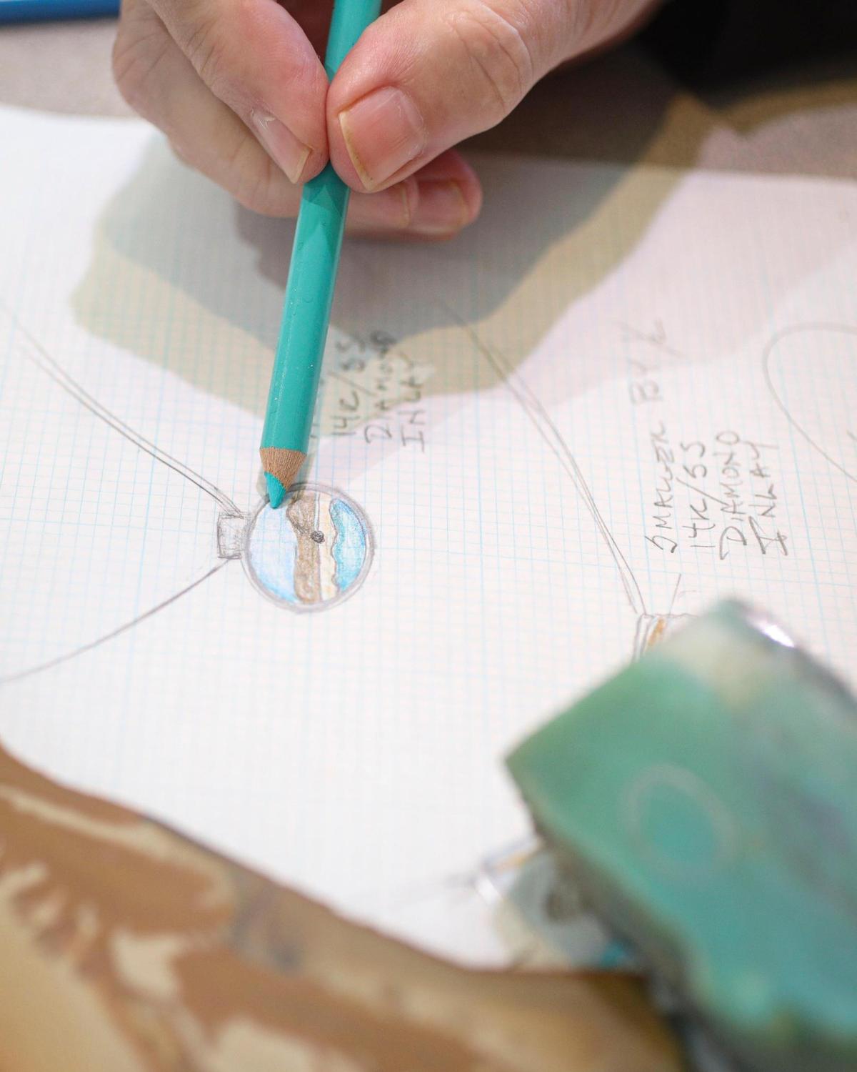 Claudia Alexander-Denny, who owns Alexander-Denny Jewelry Studio in Cambria with her husband Shawn Denny, draws a design for a necklace that will be a graduation gift, on Feb. 9, 2024. The couple have been in the jewelry business together for more than 40 years.
