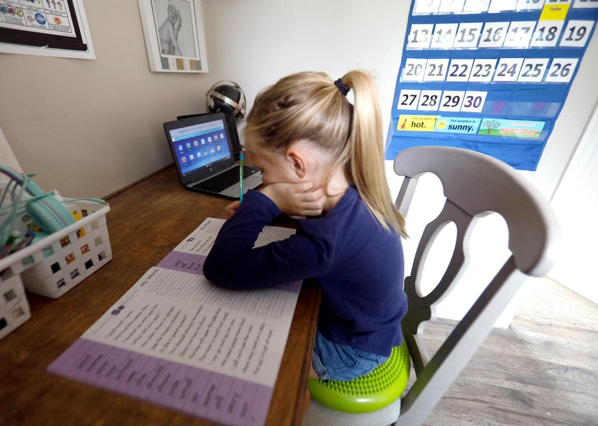 Layla Keiper, 6, works on a class assignment while distance learning with the Atascadero Unified School District.