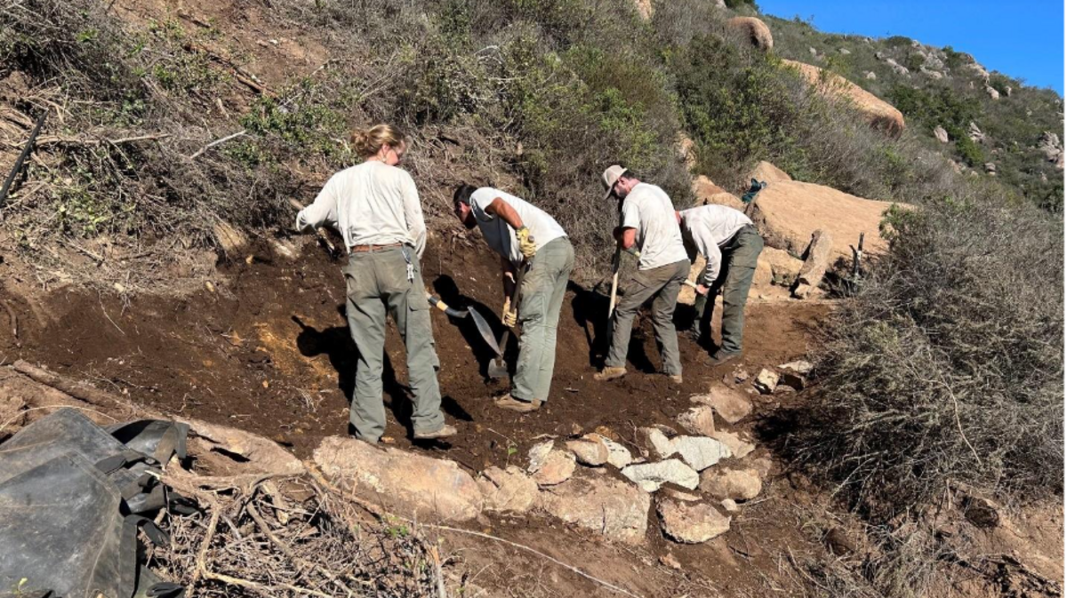Rangers improve a trail in San Luis Obispo.