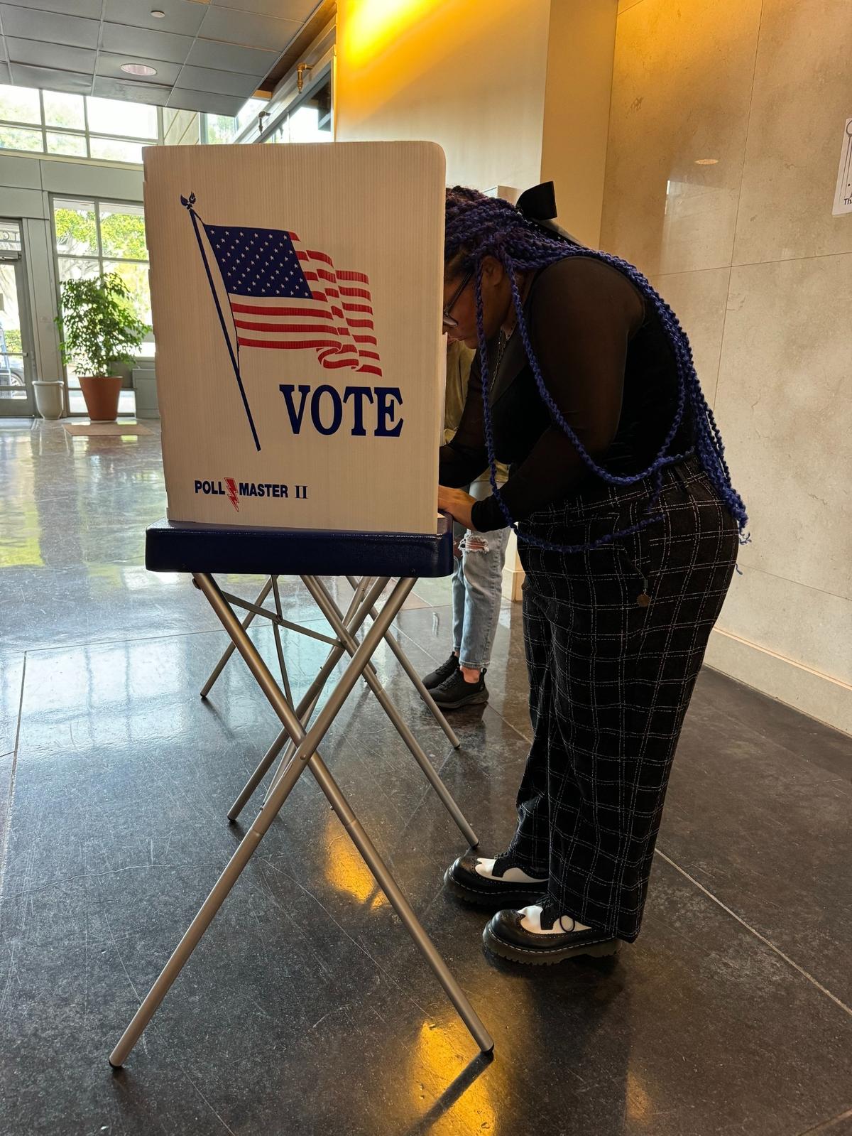 London Barker, 18, casts her ballot at the San Luis Obispo County elections office on Nov. 5, 2024. She said it was her first time voting and called it a “nerve-racking” experience.