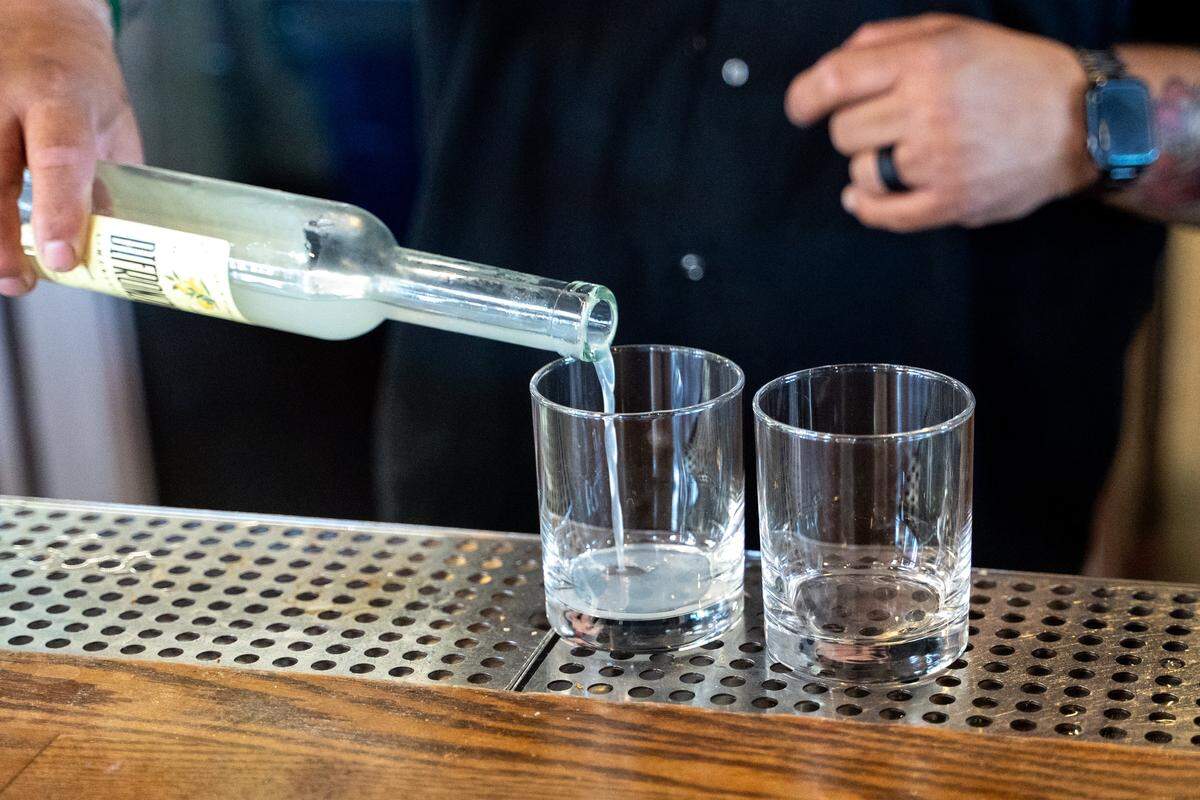 Giuseppe’s Italian American Club distiller Ulisses Avina pours fresh-made limoncello on Tuesday, May 19, 2026. The deli and restaurant expansion of the existing Giuseppe’s Cucina Italiana in Pismo Beach recently started its own offshoot brand of limoncello.