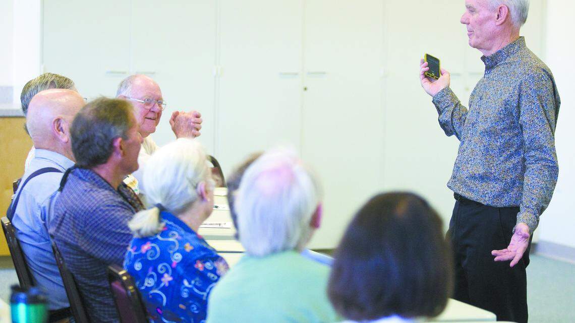 Pat McKeague lectures a group about "A Spiritual Side to Mathematics" in a class offered by Lifelong Learners of the Central Coast.