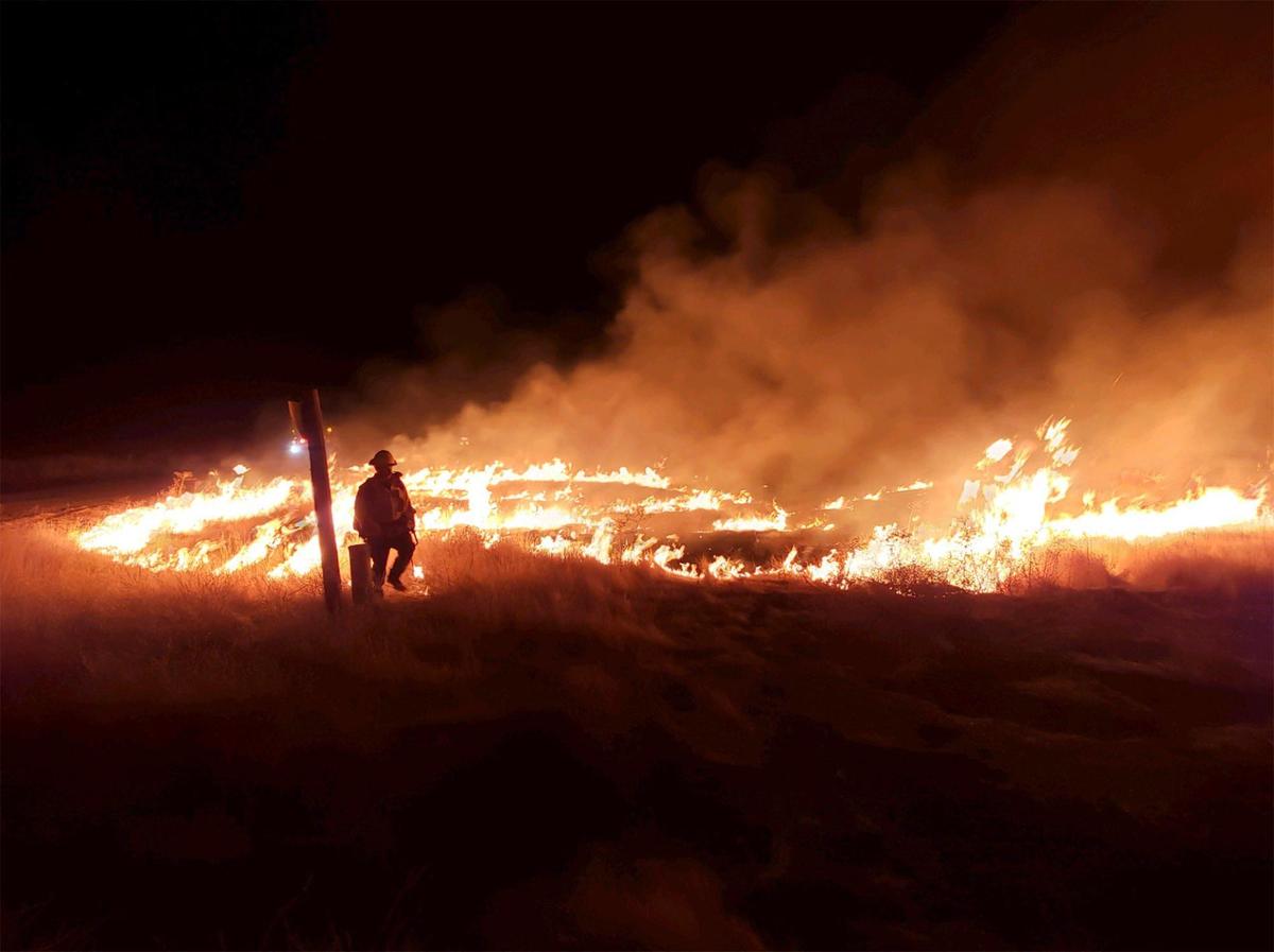 A travel trailer on a property caught fire and grew to over 100 acres fire before it was contained by Cal Fire firefighters on Christmas Day.