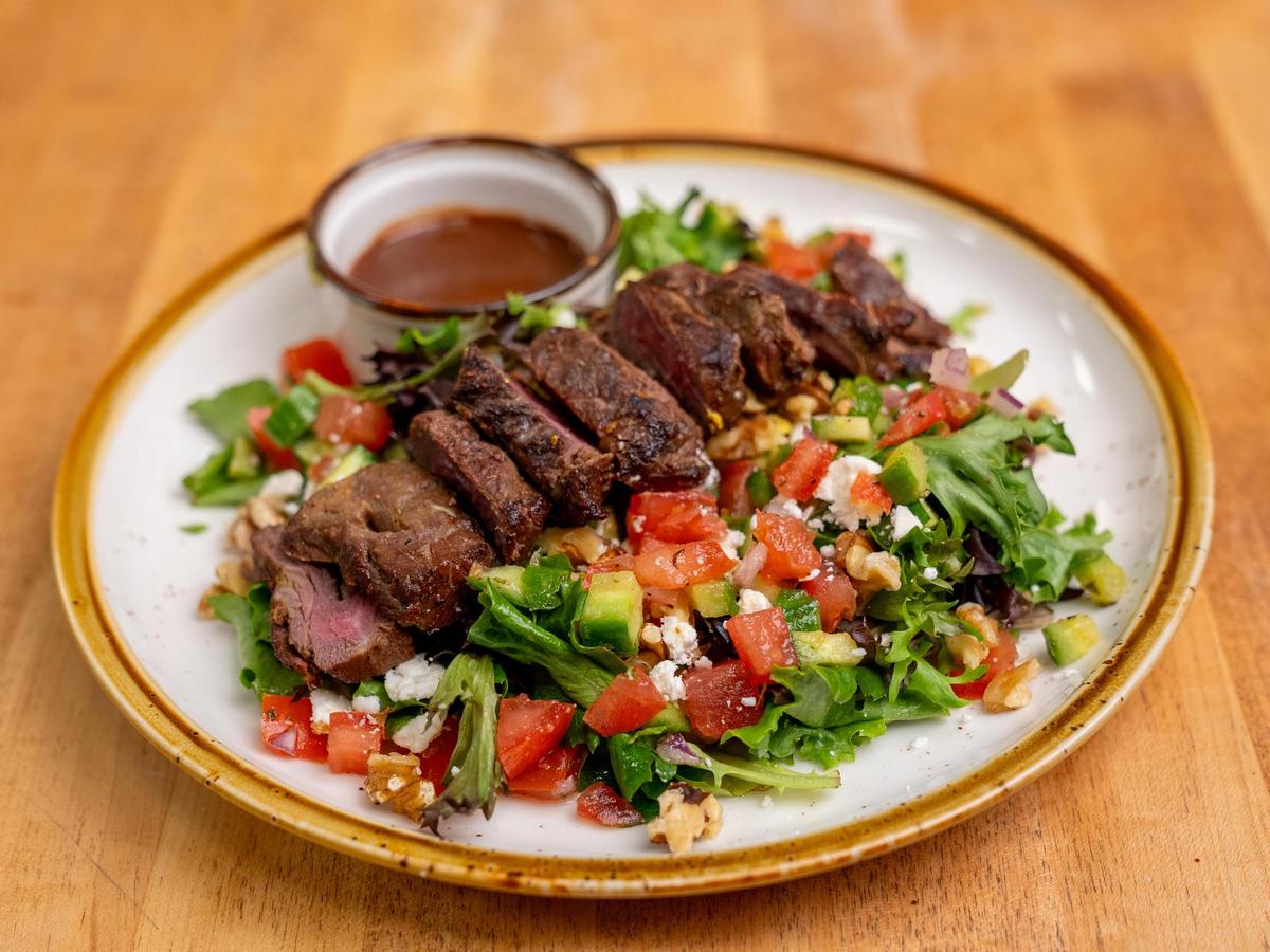 A steak salad served over fresh vegetables. Shekamoo Grill celebrated its grand opening at SLO Ranch Farms & Marketplace in late January 2025. The new restaurant is one of the first Persian cuisine spots in San Luis Obispo.