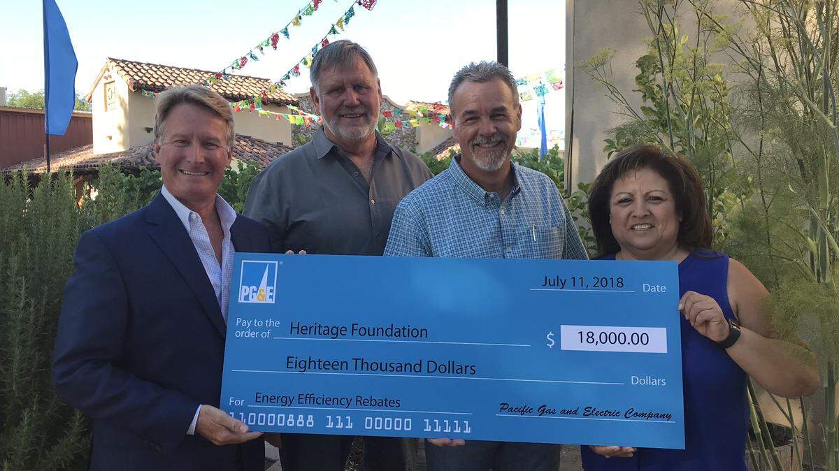 Eric Daniels, Chris Darway, Dave Belmont and Perla De Leon pictured with the $18,000 rebate check awarded to the Mid-State Fair Foundation.