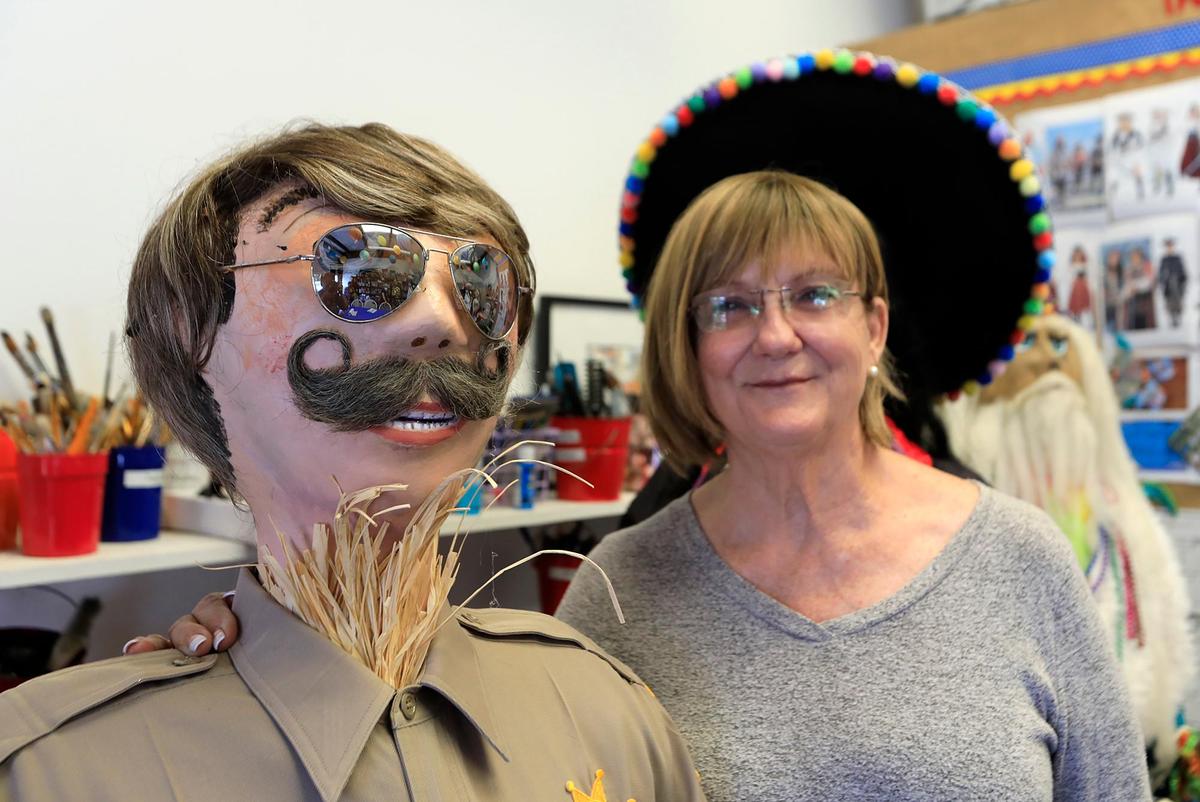 Paula Ufferheide, Cambria Scarecrow Festival president of the board, poses with her “Sarge,” a favorite scarecrow. The Cambria Scarecrow Festival will be held this year. The highlight will be a Pirate display featuring a pirate ship, a “kraken’ and treasure chest scene.