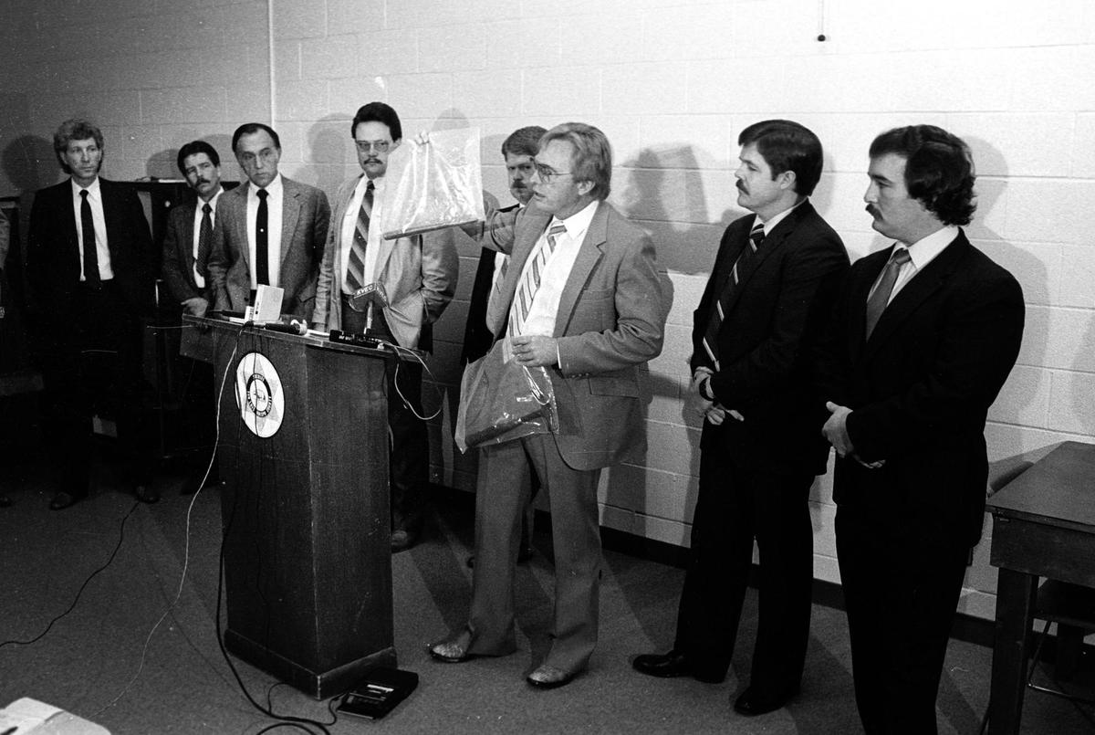 Sheriff’s Lt. John Hastie holds two bags of evidence collected in the case against Richard Allen Benson. Hastie displayed the evidence at a press conference Jan. 10, 1986. Benson, a convicted child molester who spent time at the California Men’s Colony, was convicted of using a hammer to beat to death Laura Camargo, 24, and her two daughters. Her toddler son was smothered to death. The unemployed jeweler set the house ablaze. “We have witnesses that can place this particular (weapon) in his possession” Hastie said of one piece of evidence. The two murder weapons were found in the charred interior of the house.