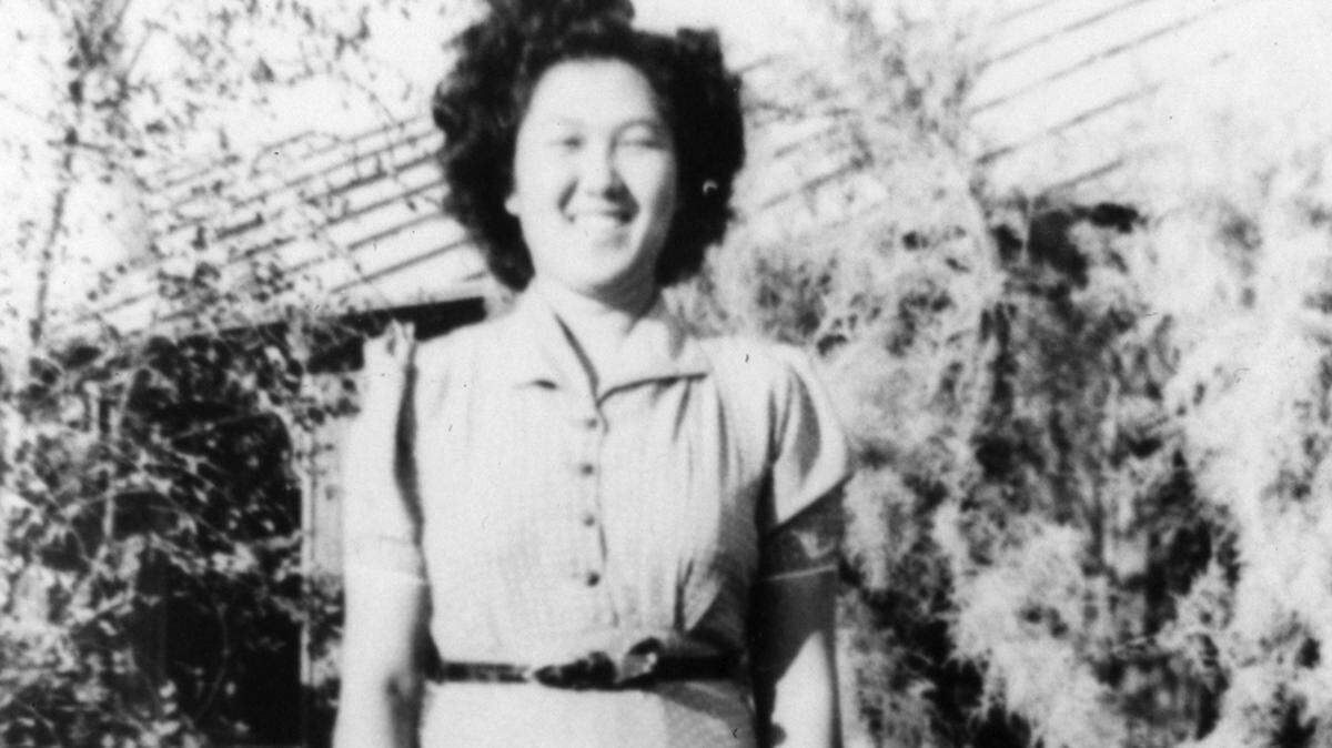Lillian Nishijima Sakurai in the Japanese Garden at the Poston War Relocation Camp, Yuma County (now La Paz County), Arizona, in 1944.