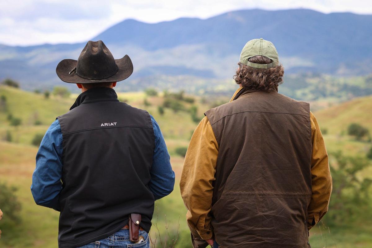 Haustin Morrison and his father Mark Morrison look out over the Camatta Ranch in eastern San Luis Obispo County. The Land Conservancy of San Luis Obispo County has completed a conservation easement on most of the ranch, which spans from the Los Padres National Forest on Highway 58 to Shandon.