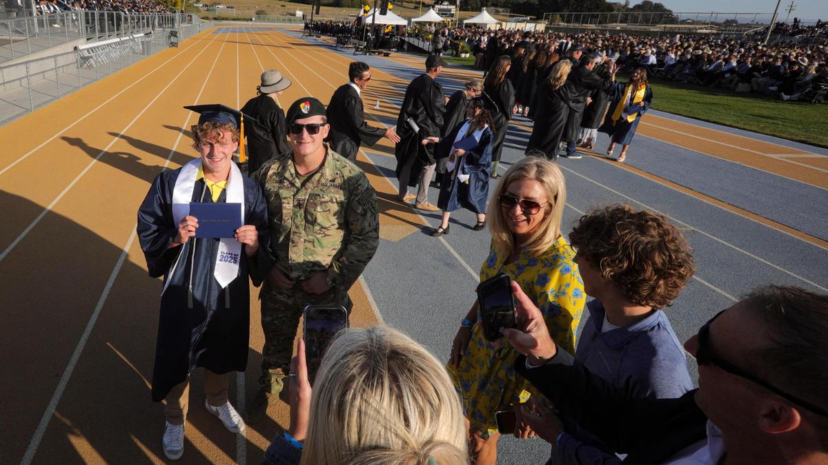 Graduate Max Tuggle gets a surprise from brother Theo who got an unexpected leave from the U.S. Army to attend graduation. Arroyo Grande High School held Commencement for 509 graduates on June 5, 2025.