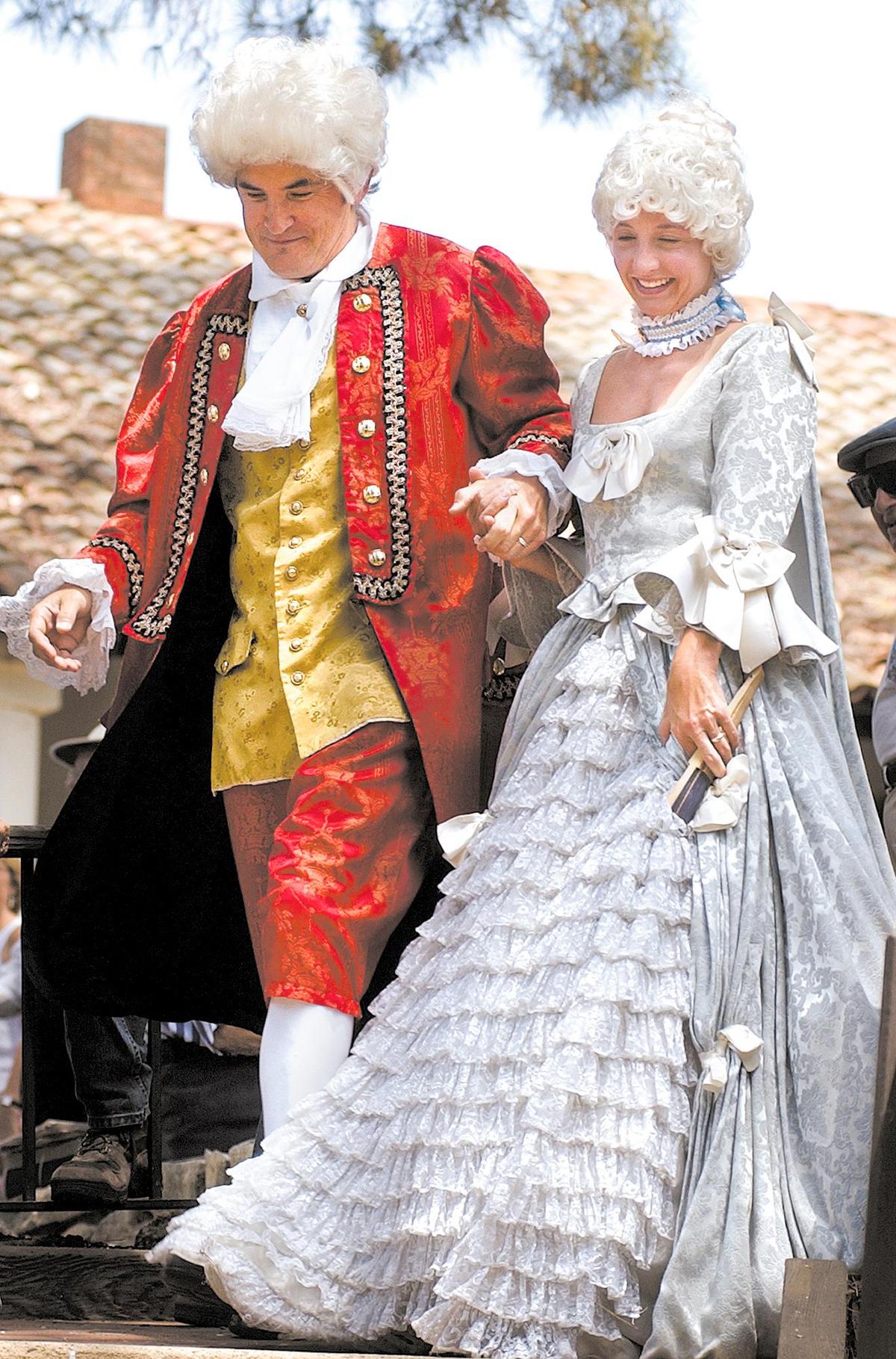 John Pillow and Lindsey Wilcox arrive as Mozart and wife Constanze for the opening of the Mozart Festival at the Mission Plaza July 18, 2003.