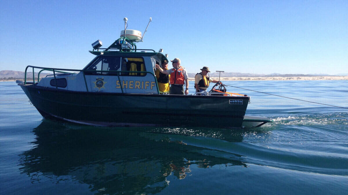 Authorities on a SLO County Sheriff's Office boat use sonar equipment in the area where a plane went down off the coast of Oceano.