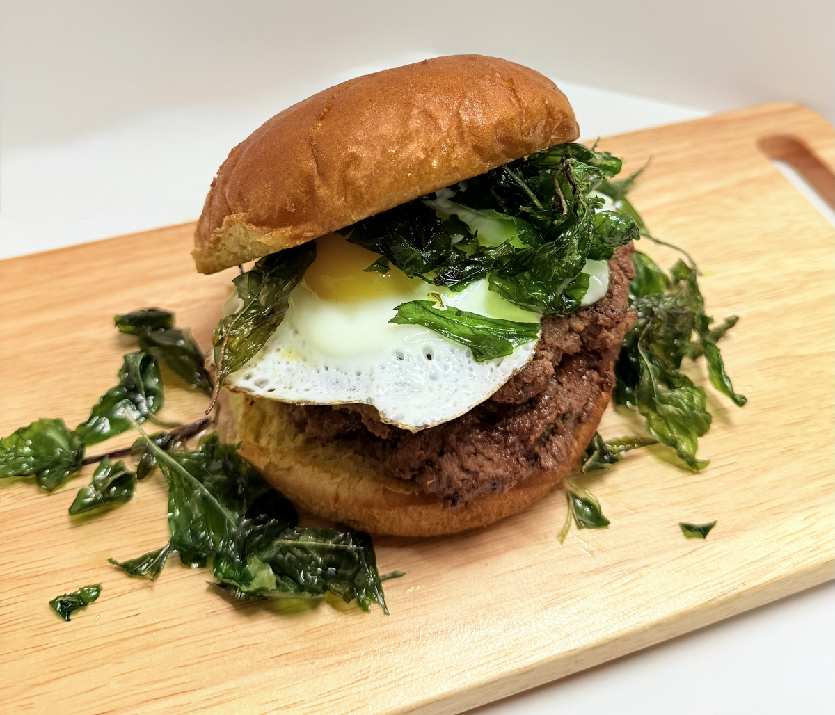 The chili basil burger at Infused Thai Fusion Kitchen in Morro Bay contains a homemade beef patty with a fried egg, grilled onions and crispy sweet basil.
