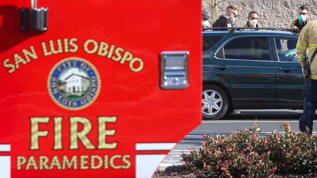 San Luis Obispo City firefighters and San Luis Ambulance gather information at a call for someone with fever and labored breathing.
