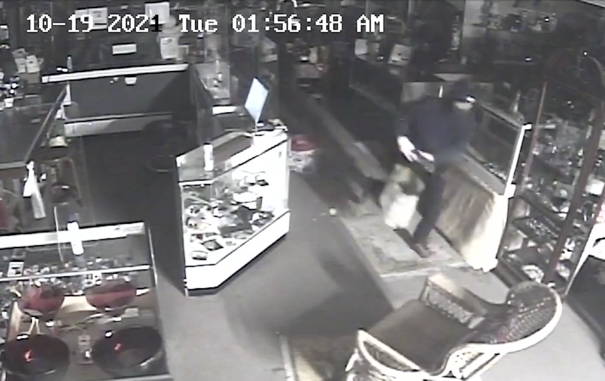 A burglar dashes out of the Rich Man Poor Man Antique Shop in Cambria after a break-in on Oct. 19, 2021. On May 4, 2022, the Sheriff’s Office announced two arrests in the case.
