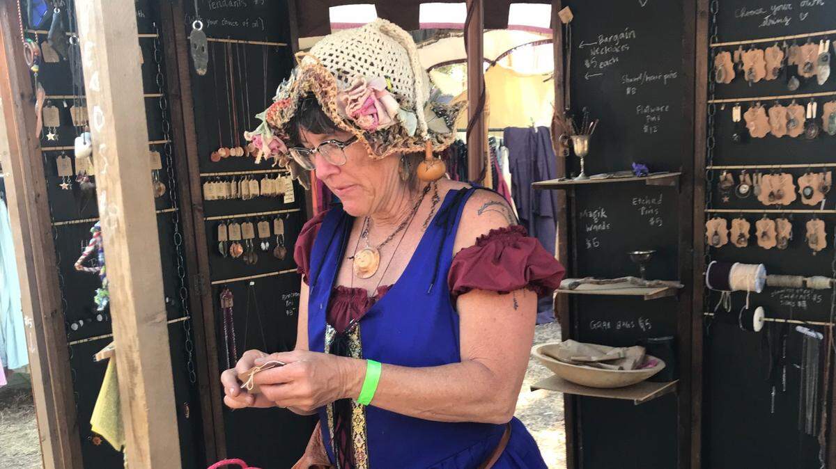 Cambrian columnist Dianne Brooke in her Lady Tie Di’s Eclectic Emporium at SLO Renaissance Faire booth.