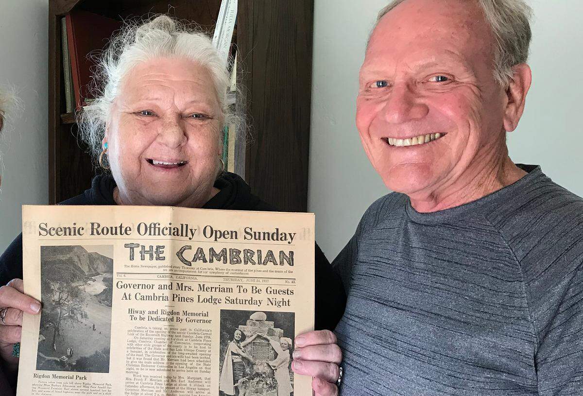 Melody Coe, president of the Cambria Historical Society board, shows John McDonald a treasured edition of The Cambrian, part of the newspaper’s collection of “morgue copies” that were transferred to the historical society during the past couple of years. The June 24, 1937, issue heralded the opening of the new Highway 1 through Cambria. John McDonald’s stepfather was longtime Cambrian owner, publisher and editor Scoop Morgan.