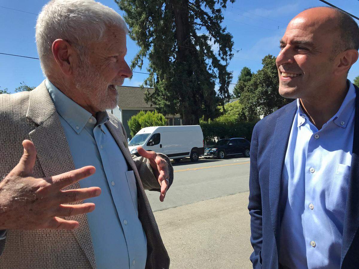 County Supervisor Bruce Gibson and U.S. Rep. Jimmy Panetta chat about politics, partnerships and friendships Wednesday, July 17, before a press conference in which Panetta and the Cambria Community Healthcare District officials announced a $1 million federal grant toward rebuilding the district’s ambulance garage and paramedic housing building.