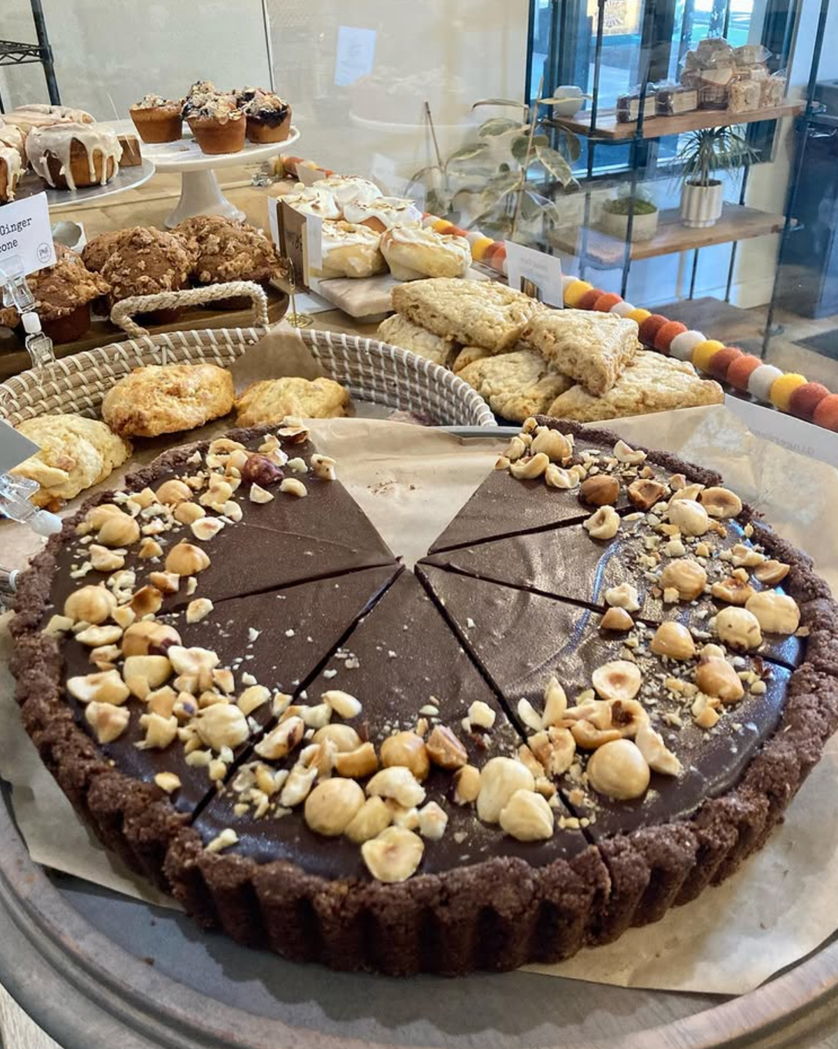A dark chocolate tart inside the display cases at Proof & Gather’s location in downtown SLO.