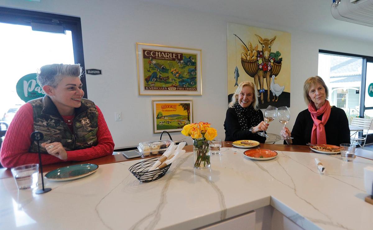 Afternoon customers, Cristina Robins, Templeton, from left, Jane Manning and Pam Anderson, from Utah wait for their pizzas. Afterwards, Robins said, “The (pizza) was absolutely delicious, the crust was delightful and the sauce was tangy. Two thumbs up, definitely 10 out of 10.”