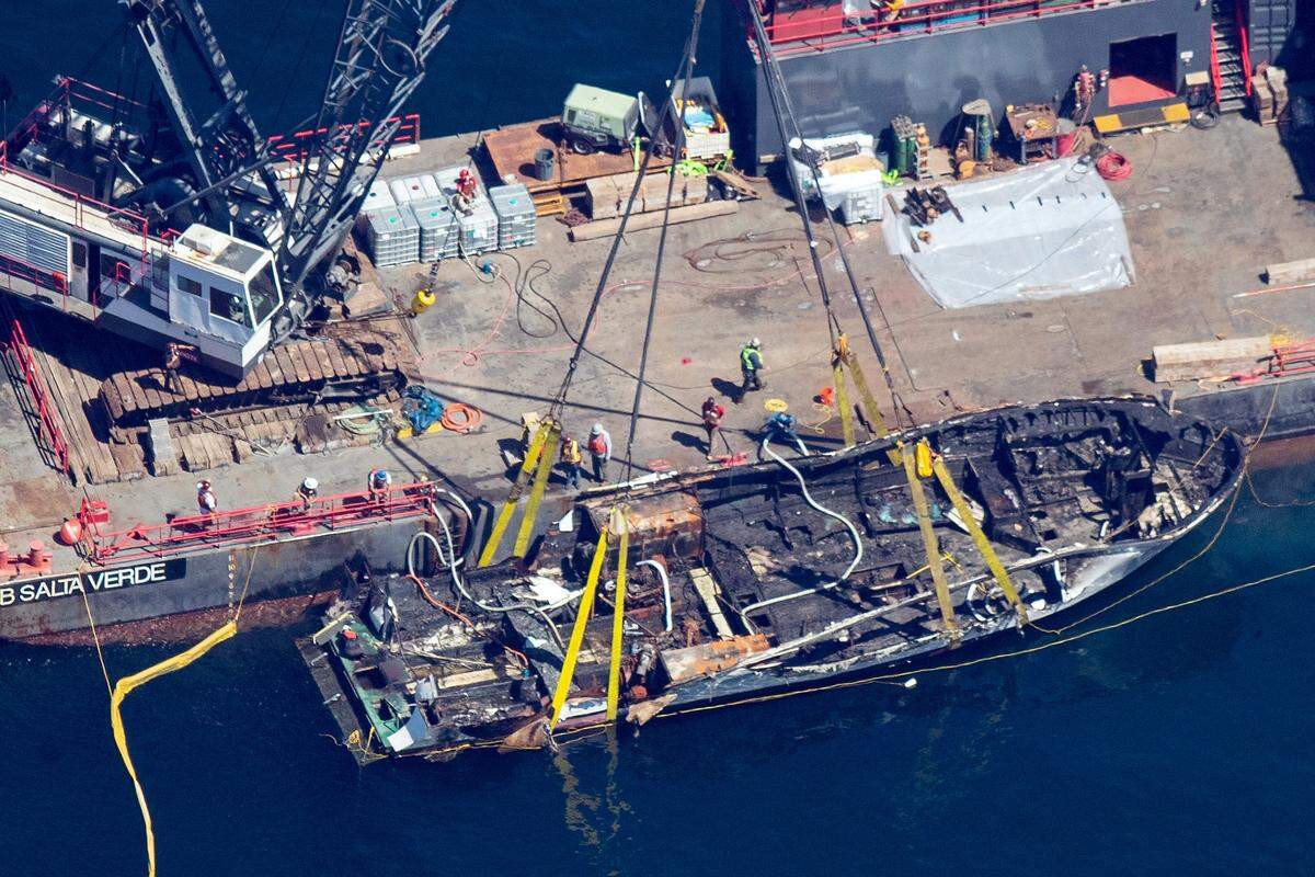 The burned hull of the Conception is brought to the surface by a salvage team on Thursday off Santa Cruz Island. The vessel burned and sank on Sept. 2, taking the lives of 34 people aboard. Five survived.