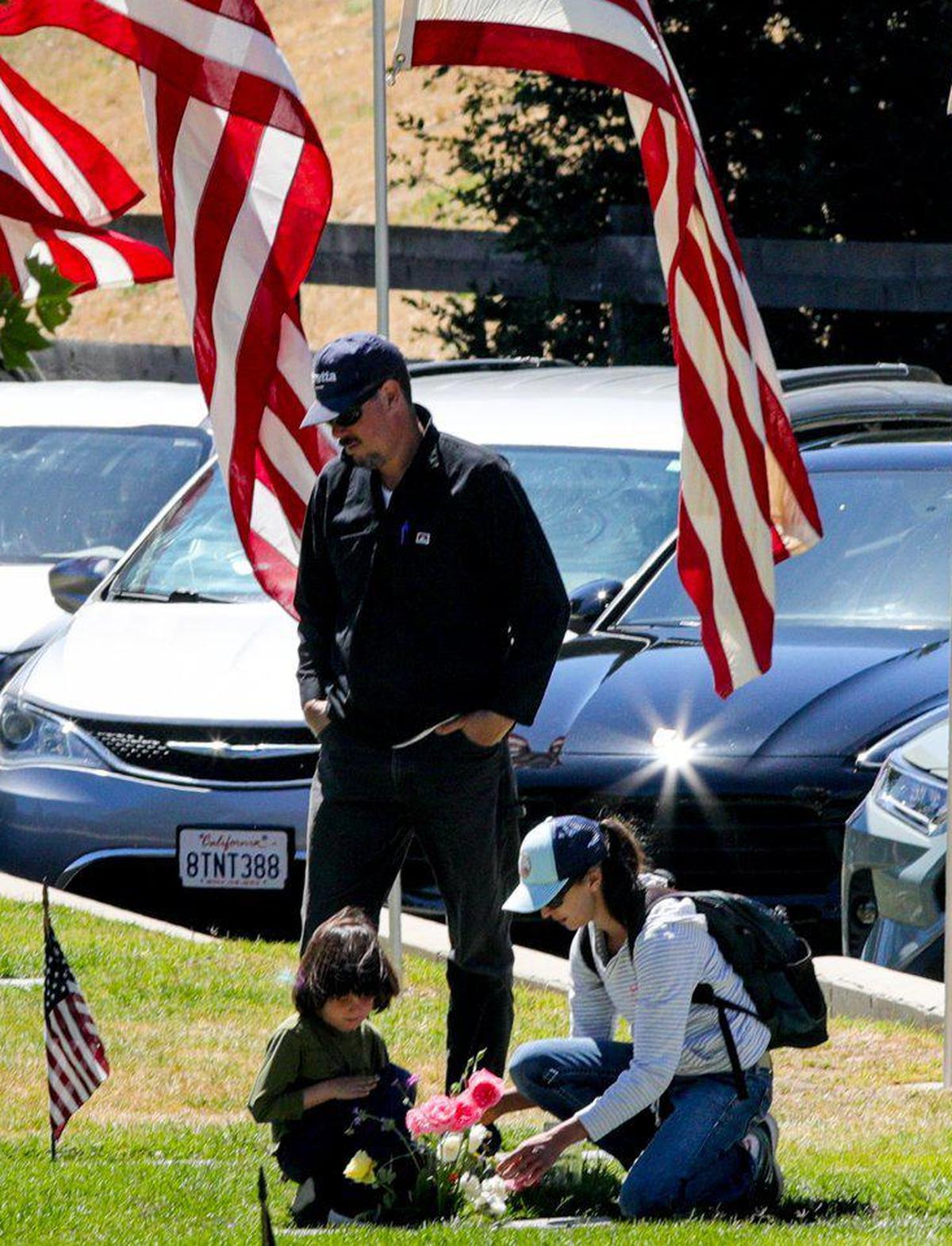 From left, Ben, Greg and Sarah Saenz paid their respects to Sarah’s grandfather, Robert N. Milner, a Korean War veteran, on Memorial Day, May 30, 2022, at the Paso Robles District Cemetery.