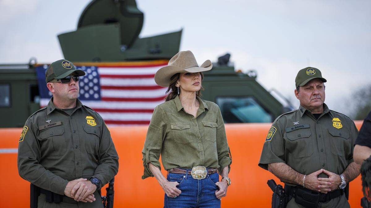 U.S. Secretary of Homeland Security Kristi Noem stands alongside U.S. Border Patrol Rio Grande Valley Sector Chief Jared Ashby, left, and U.S. Border Patrol Chief Mike Banks at a news conference on Jan. 7, 2026 in Brownsville, Texas. Secretary Noem announced that the federal government would be deploying 500 miles of water barriers in the Rio Grande river.