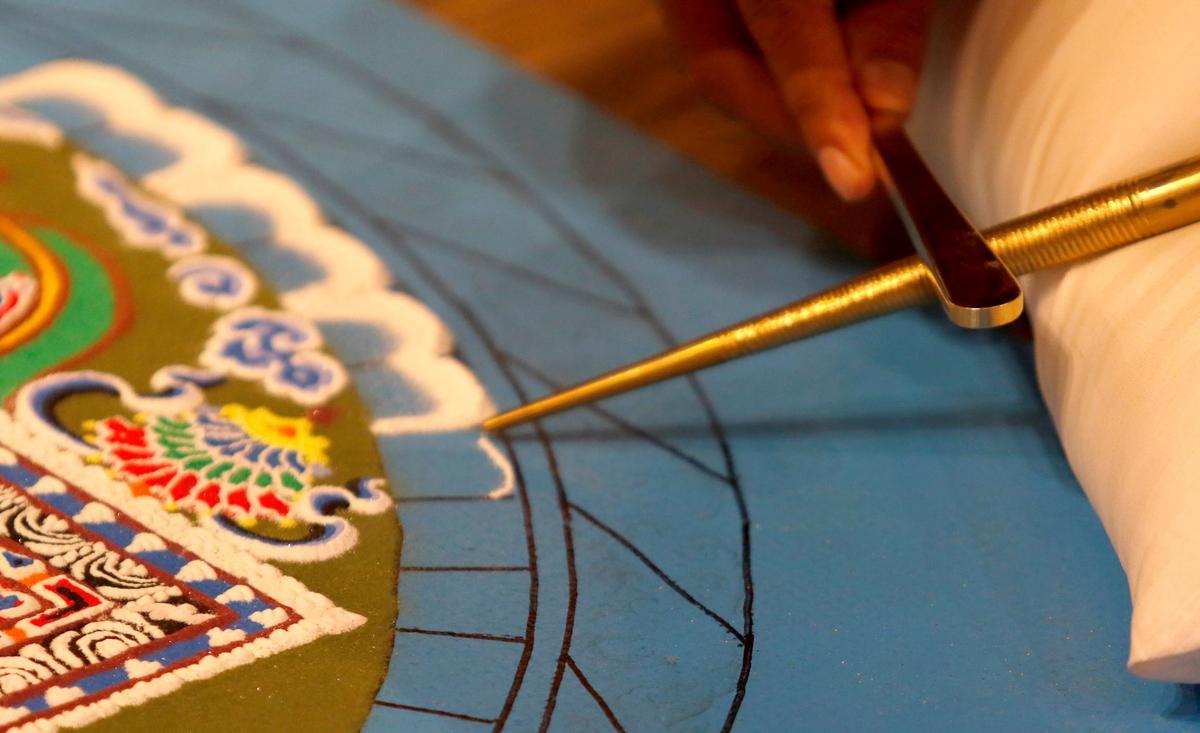 Tibetan monks from India began to build a sand mandala at the Aligned Acupuncture and Wellness Spa in San Luis Obispo on Sept. 24, 2024. They will destroy the mandala on Sept. 27, 2024.