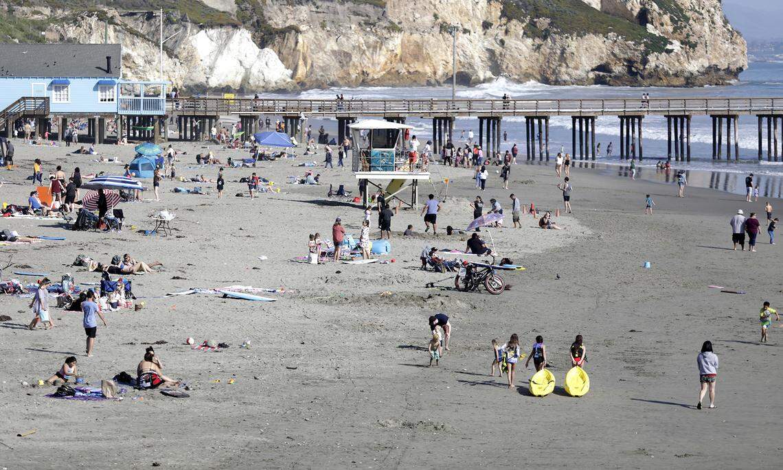 People pack Avila Beach on a recent warm weekend.