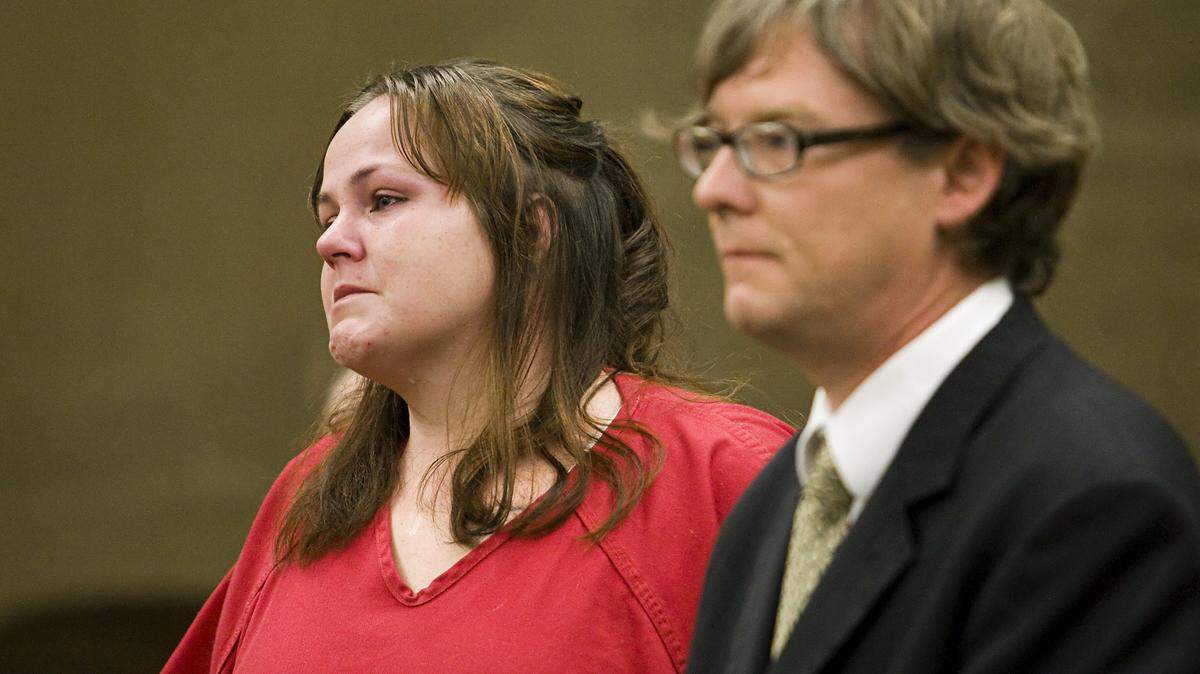 Christine Lee Garner stands with her lawyer, Trevor Creel, in July 2013 as she accepts a plea deal in the assault and robbery of Victor Hugo Sanchez, who was later killed outside his Paso Robles home.