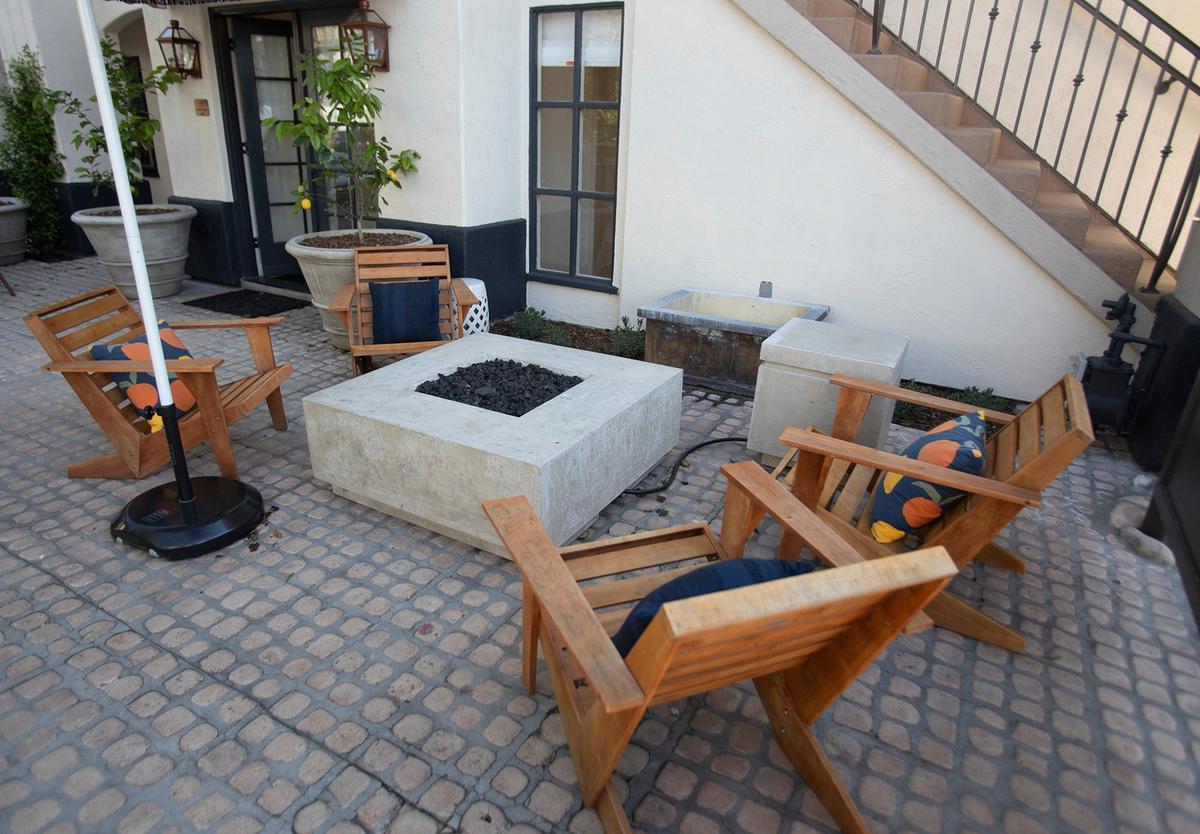 Petit Soleil, located at 1473 Monterey St., reopened under new management in mid-March. The 17-room mini hotel was bought by Good Lion Hospitality, under the leadership of husband-and-wife team Misty and Brandon Ristaino. The front patio with an outdoor fireplace.