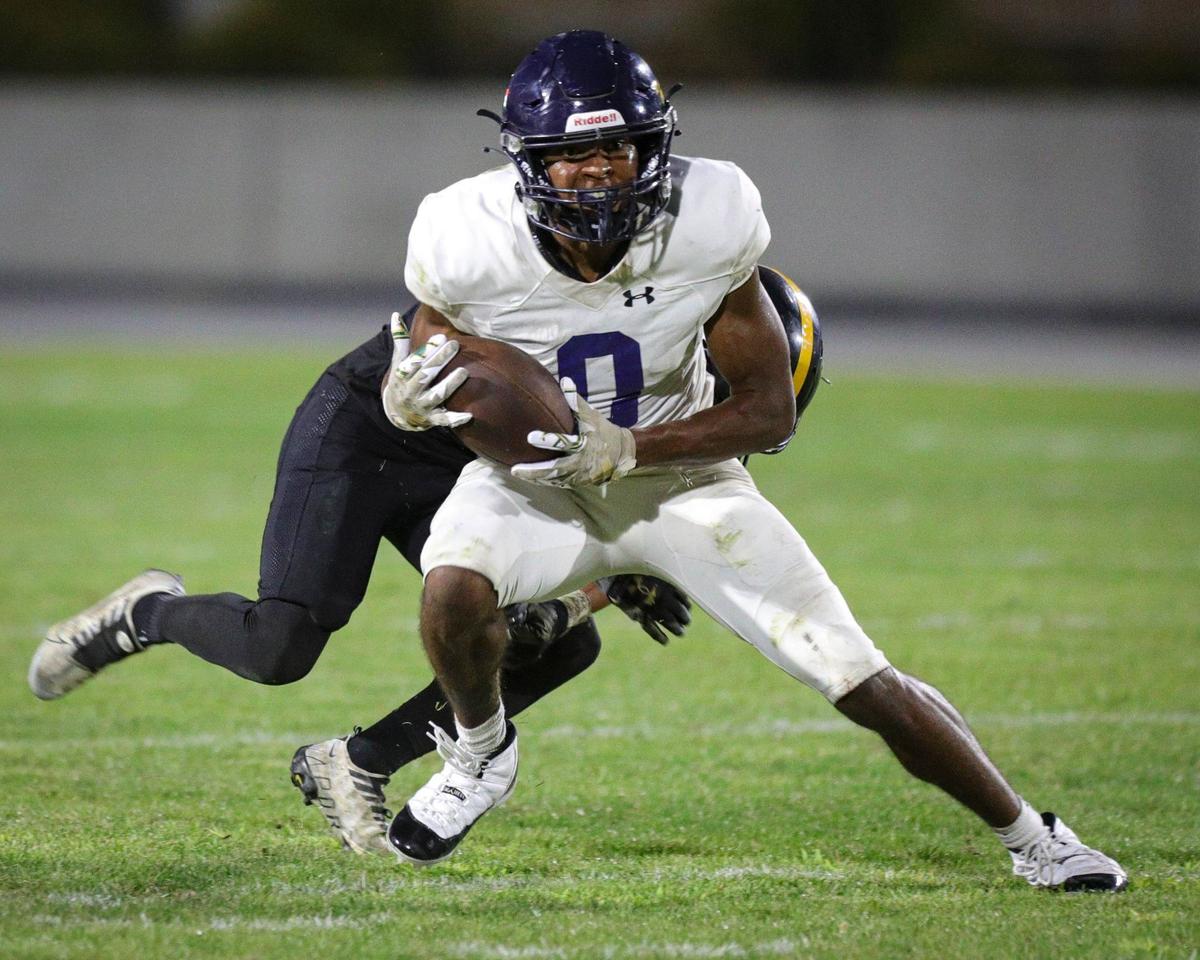 Caleb Clark eludes the tackle and takes this catch into the end zone for a touchdown. Arroyo Grande beat San Luis Obispo 23-0 in a high school football game on Sept. 6, 2024.