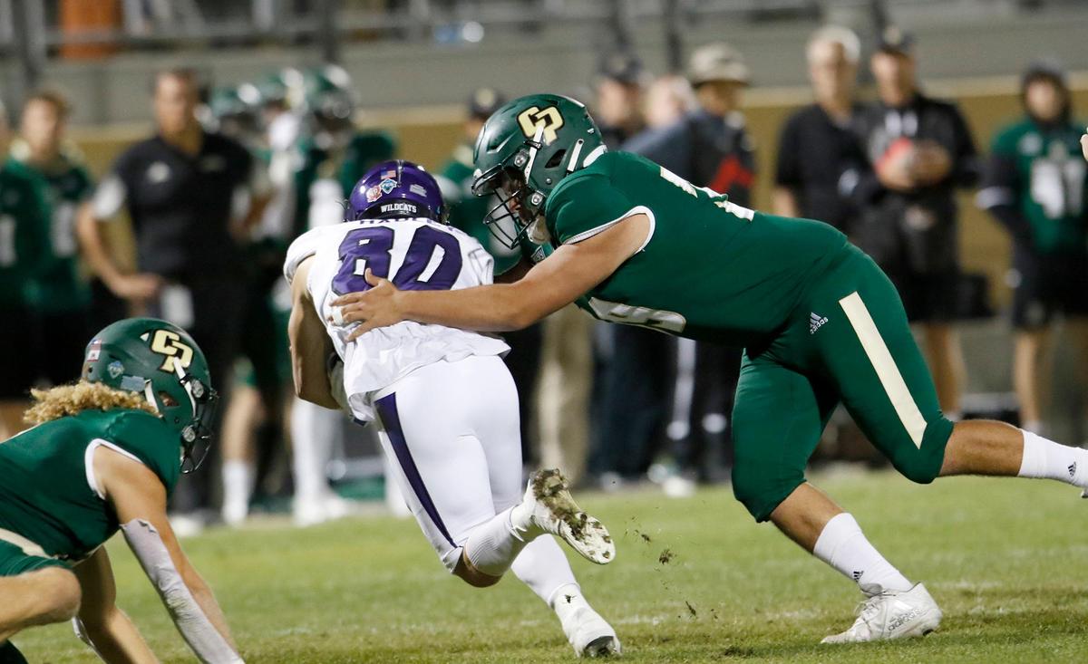 Cal Poly’s Cruz Rubio (39) tackles Weber State’s Haze Hadley (80). Cal Poly lost 38-7 to Weber State at Alex G. Spanos Stadium, on Saturday, Oct. 2, 2021.