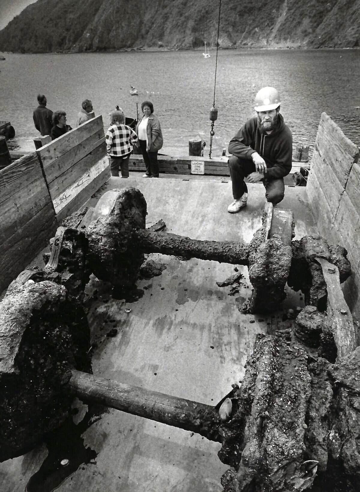 Port San Luis worker Steve Suisse surveys rusted Pacific Coast Railway narrow gauge axles and wheels recovered from off of Harford Pier, April 12, 1989.