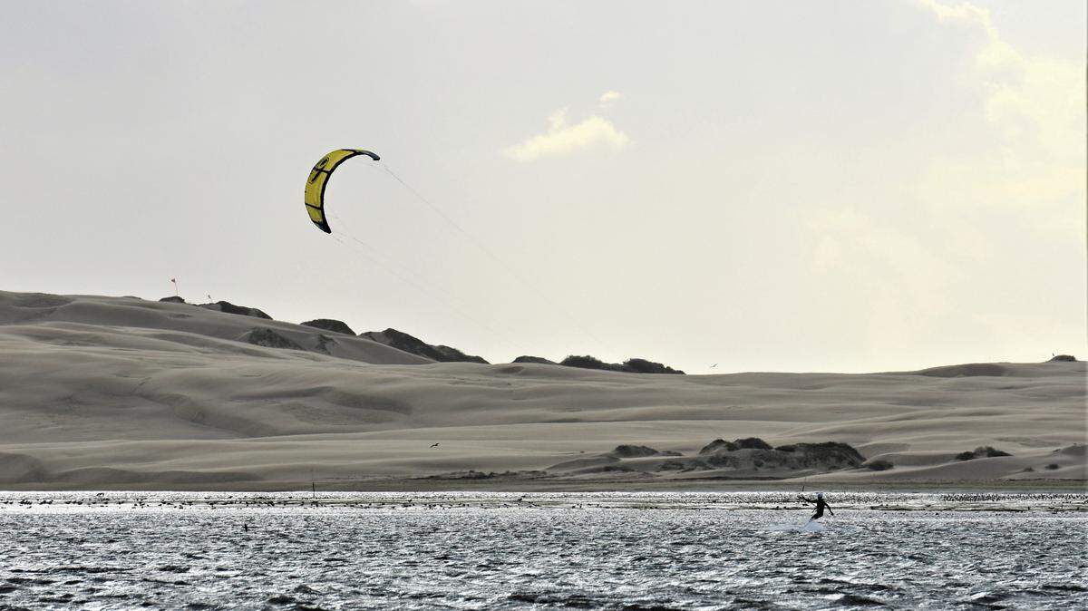 A kitesurfer enjoying the strong northwesterly winds in Morro Bay.