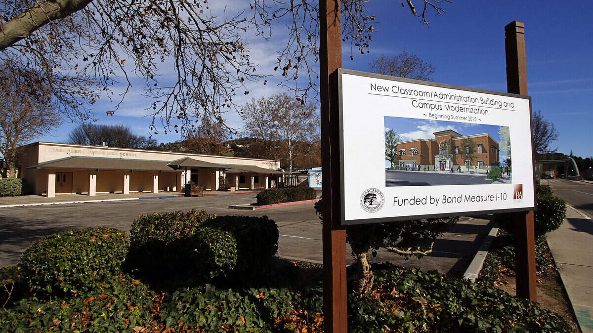 A sign in front of Atascadero Junior High School says that a new classroom, administration building and campus modernization project will begin this summer.