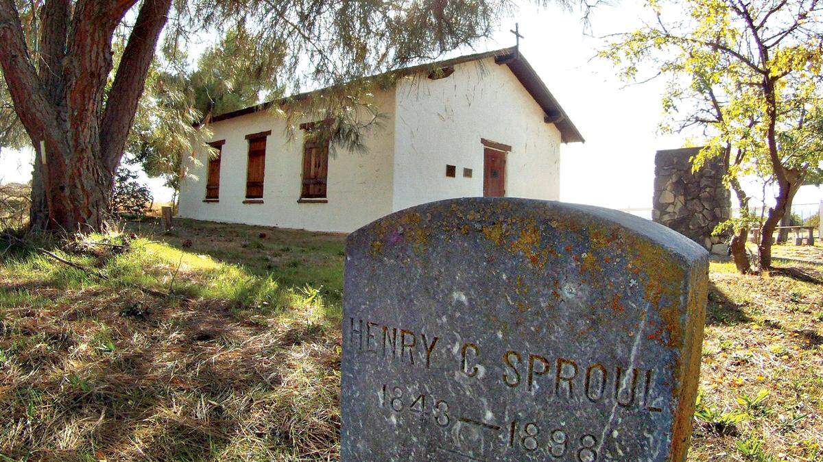 A gravestone from 1898 sits in the cemetery outside the historic Estrella Adobe in Paso Robles.