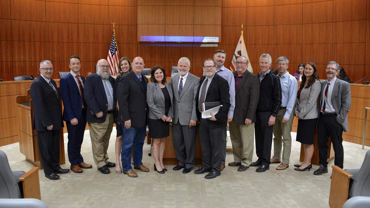 A new housing deal brought forward by a coalition of San Luis Obispo County organizations was adopted by the Board of Supervisors. Pictured, from left to right, are Ken Trigueiro, Michael Hopkins-Tucker, Jerry Rioux, Melissa James, Superviosr John Peschong, Supervisor Debbie Arnold, Supervisor Bruce Gibson, Supervisor Adam Hill, Andrew Hackleman, Davie Cooke, Brac Brechwald, Lenny Grant, Loreli Cappel and Scott Smith.