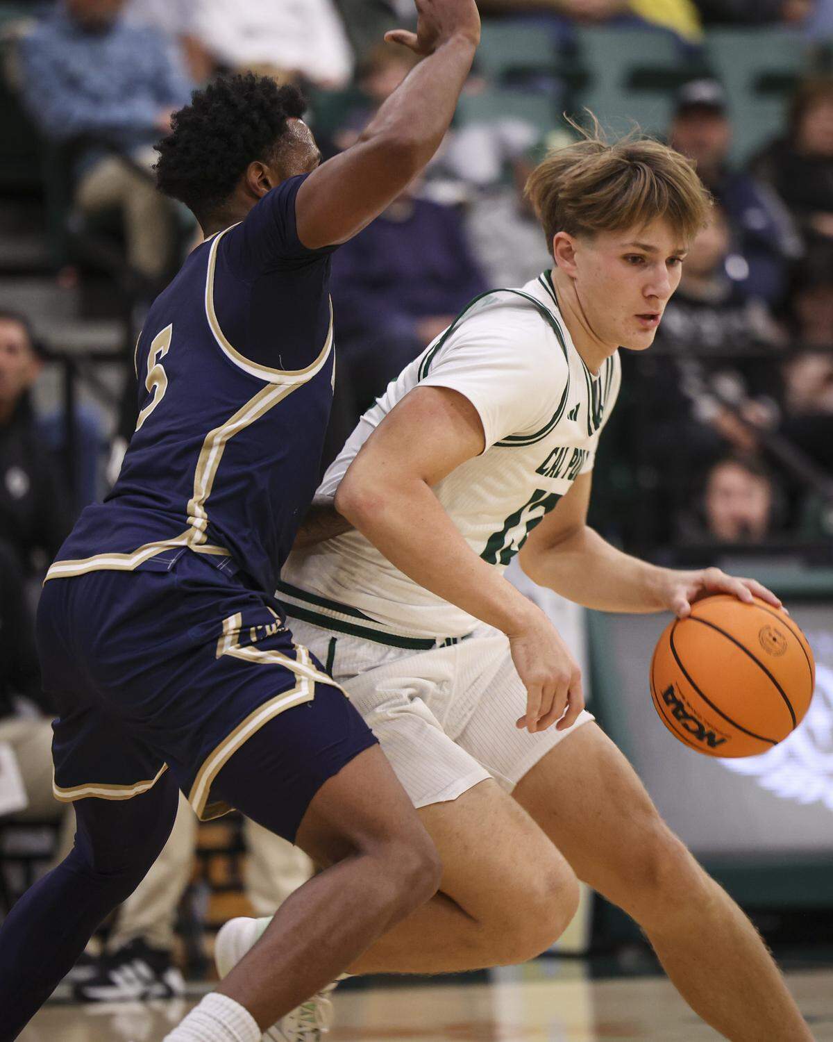 Troy Plumtree dribbles as Jeremiah Davis defends. Montana State beat Cal Poly 83-80 in a men’s basketball game on Dec. 16, 2025.