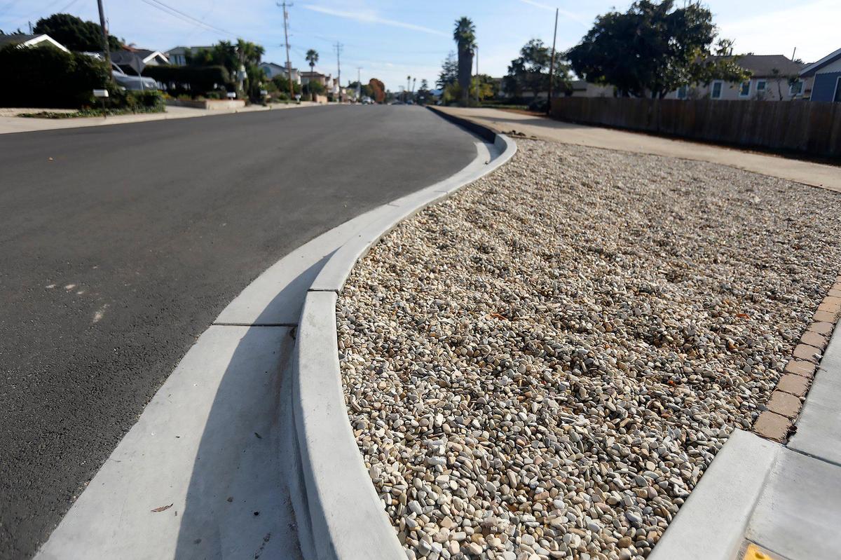 Newport Avenue was narrowed and decomposed granite walkways and hardscape were added.