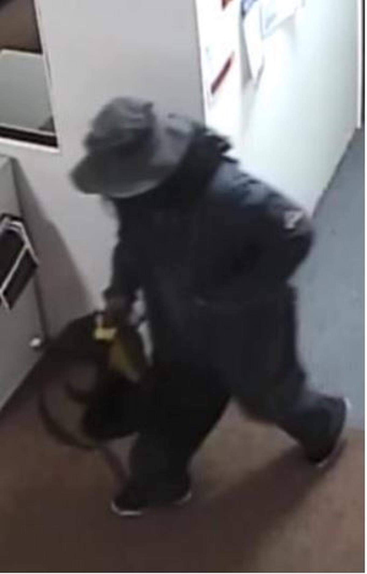 A suspect is captured by surveillance footage robbing the Check Into Cash in the 1000 block of Kennedy Way in Morro Bay on Nov. 20, 2019.