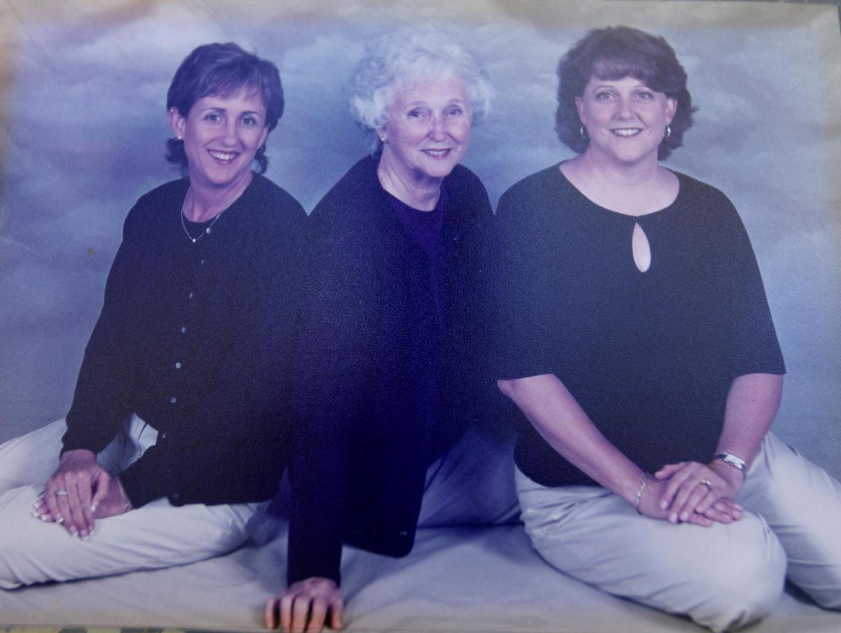 A family photo of Lori Head and Melinda Luce with their mother, Margery McGoff, who died in July from the coronavirus.