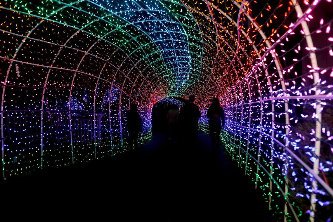 People walk through the Tunnel of Lights display at the Cambria Christmas Market. The popular San Luis Obispo County holiday event will reopen to the public in November 2022.