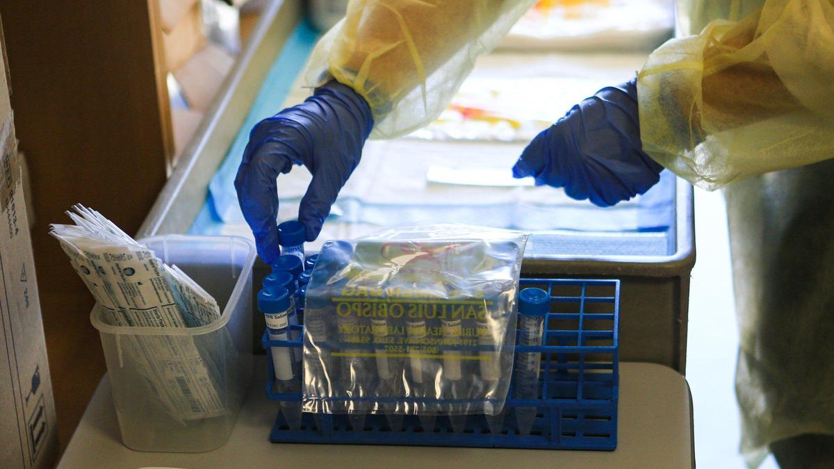 Kathrine Parra helps organize COVID-19 testing kits at the San Luis Obispo County Public Health Department in 2020.