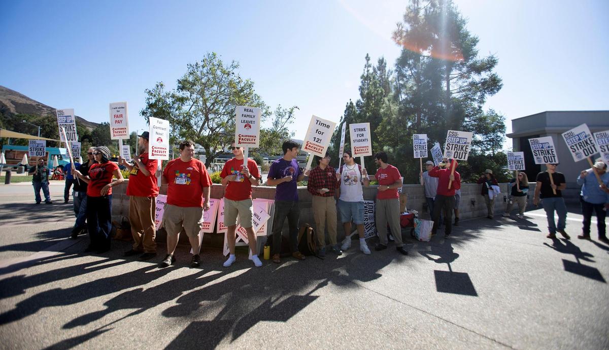 Members of the California Faculty Association picketed outside a Cal Poly alumni event at the Performing Arts Center on Friday, Oct. 27, 2023, in support of higher state university salaries.