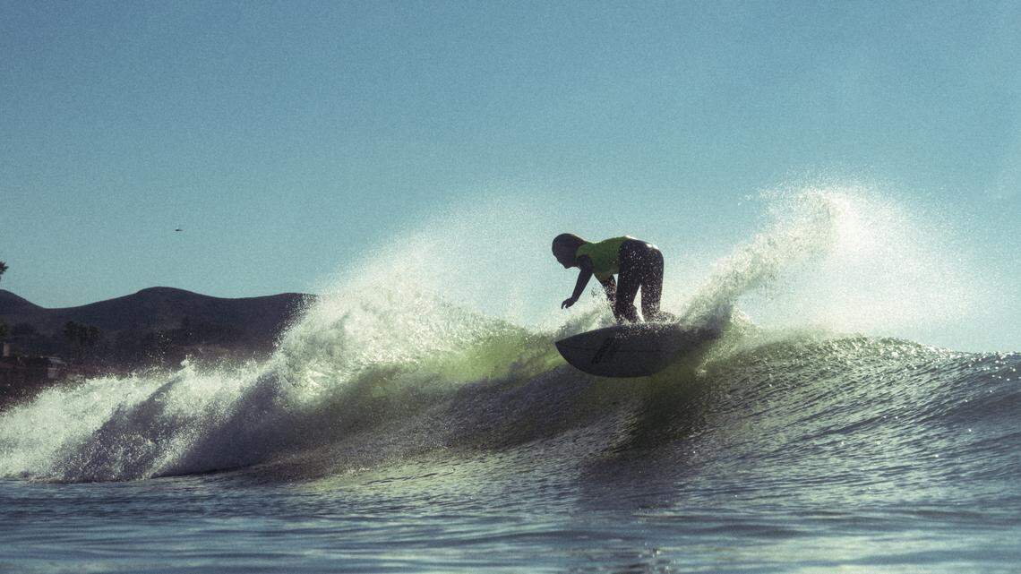 A surfer competes in the third annual Diva Cup Surf Invitational, San Luis Obispo County’s only woman’s surf competition, in Cayucos on Nov. 22, 2025.