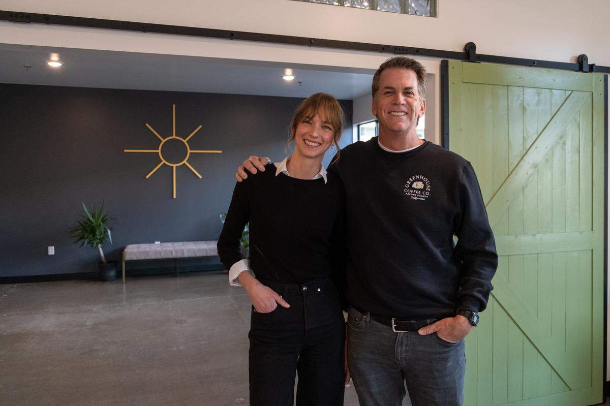 Emily Perry (left) and her father, Mark Perry, post inside Greenhouse Coffee Co. in Arroyo Grande on Jan. 21, 2023. The two opened the coffee shop in July 2022.