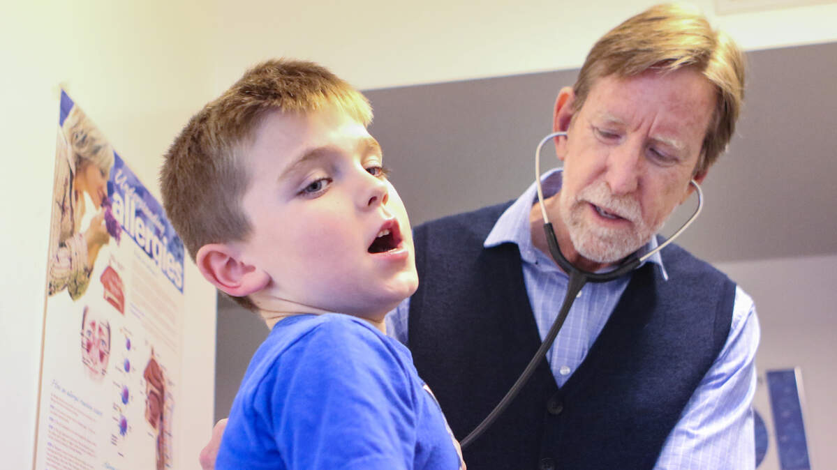 Dr. William Morgan, a pediatrician in Arroyo Grande, asks Kagan Stump to take a deep breath as he listens with a stethoscope in 2020. Asthma rates in San Luis Obispo County have steady increased since 2014, according to the SLO County Department of Public Health.