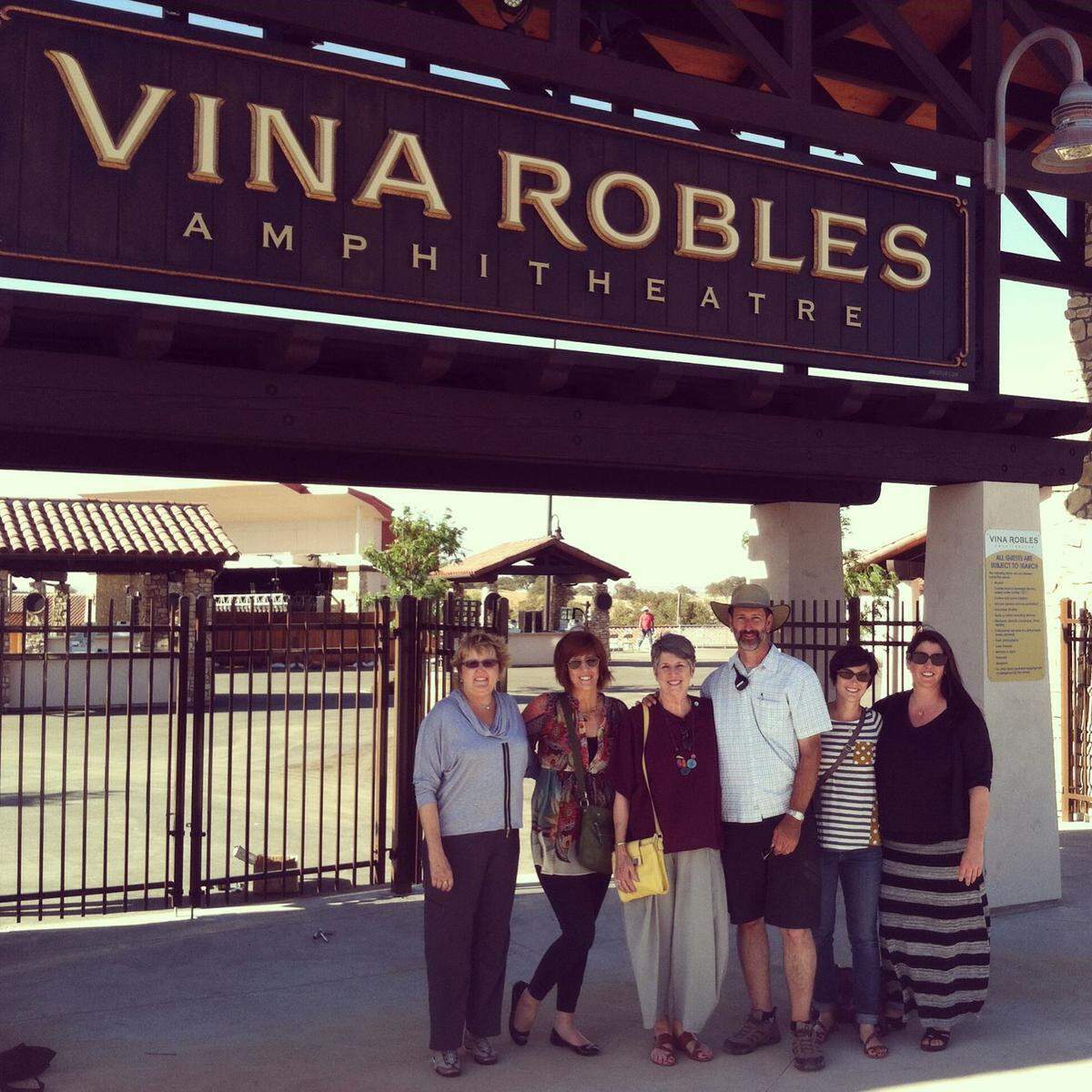 Former Vina Robles Ampitheatre general manager Tim Reed, third from right, takes a photo with family members during the grand opening of the popular venue.