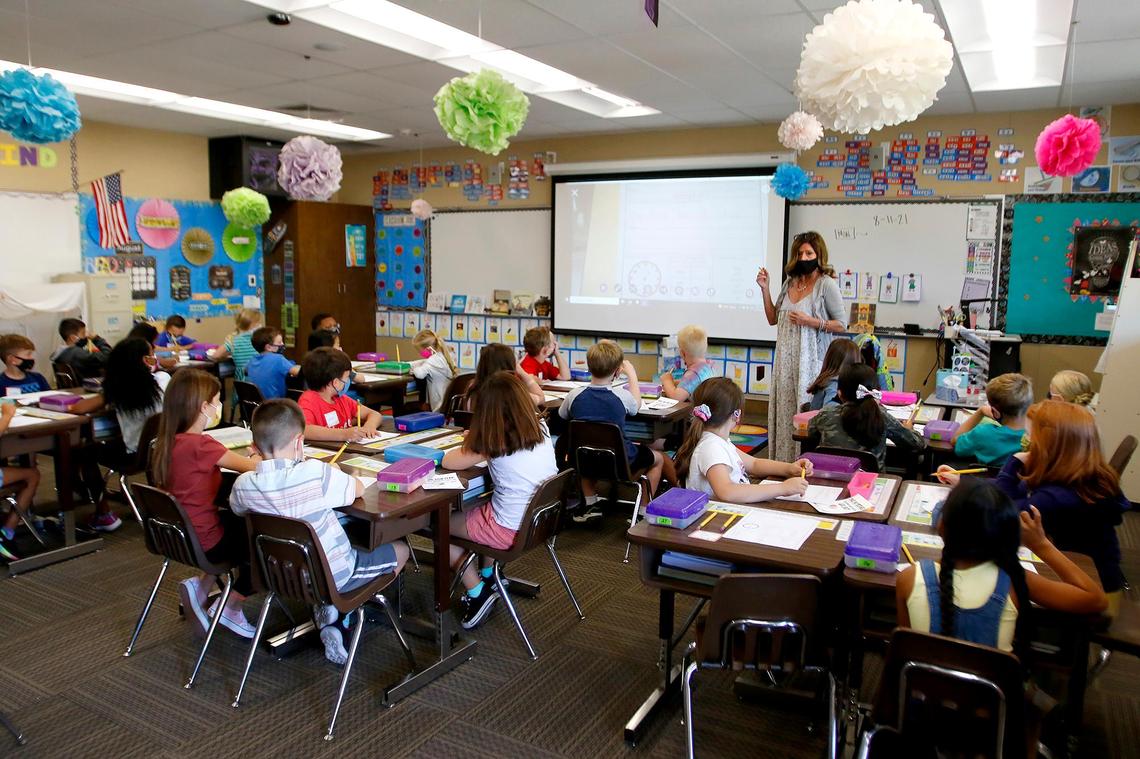 Second-grade teacher Carol Leoni talks Wednesday to her class of masked kids at San Gabriel Elementary School in Atascadero on the first day of the 2021-22 year.